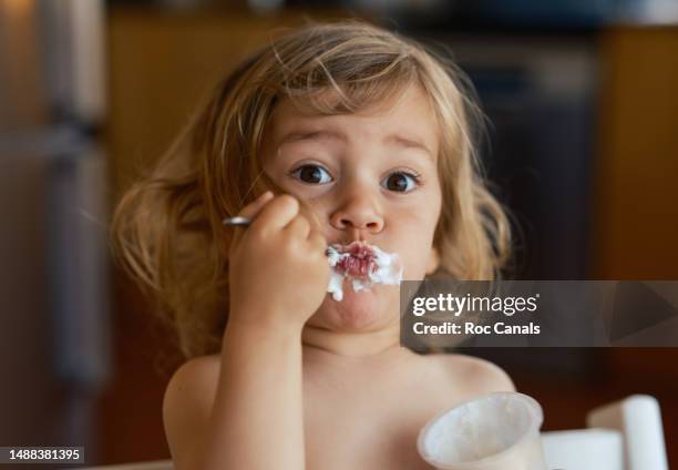 girl eating a yogurt - meal fotografías e imágenes de stock