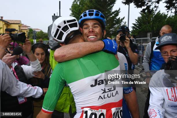 Stage winner Michael Matthews of Australia and Team Jayco AlUla reacts with his teammate Filippo Zana of Italy after the 106th Giro d'Italia 2023,...