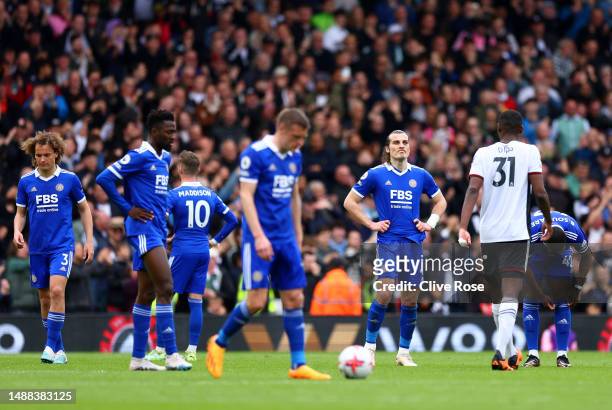 Caglar Soyuncu of Leicester City looks dejected with teammates after Willian of Fulham scores the team's fifth goal during the Premier League match...