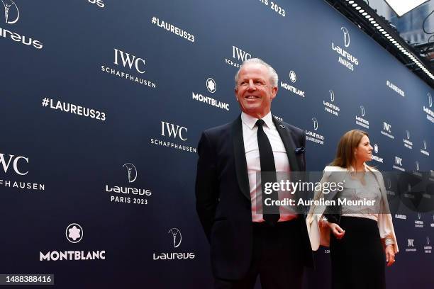 Laureus Academy Chairman Sean Fitzpatrick and guest arrive at the 2023 Laureus World Sport Awards Paris red carpet arrivals at Cour Vendome on May...