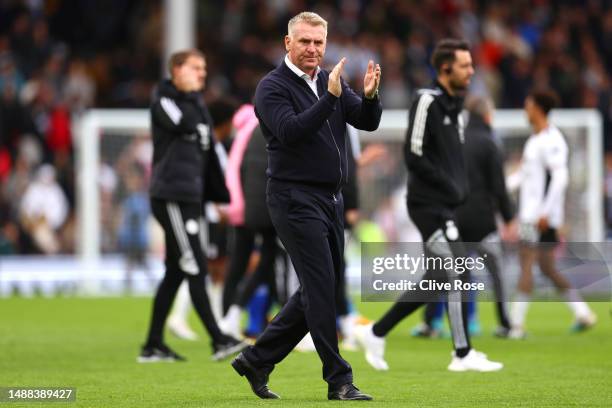 Dean Smith, Manager of Leicester City, applauds their fans after their side's defeat to Fulham during the Premier League match between Fulham FC and...