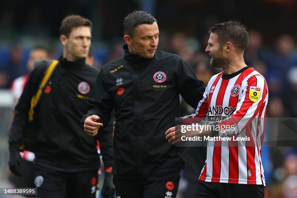 Paul Heckingbottom, Manager of Sheffield United, speaks with Oliver Norwood of Sheffield United after the Sky Bet Championship between Birmingham...