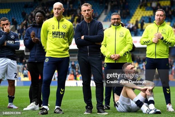 Gary Rowett, Manager of Millwall, members of backroom staff and players look dejected following the team's loss and failing to gain a play off place...