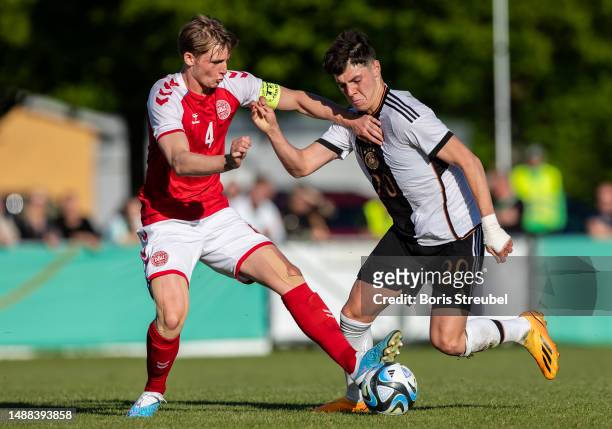 Mert Koemuer of Germany is challenged by Ludwig Vraa-Jensen of Denmark of Denmark during the International Friendly match between Germany and Denmark...
