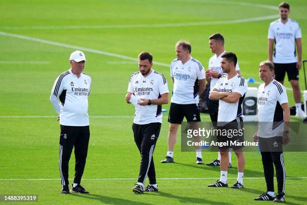 Carlo Ancelotti, Head Coach of Real Madrid, and Davide Ancelotti, Assistant Head Coach of Real Madrid, discuss during the Real Madrid training...