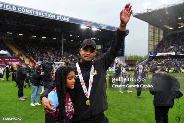 Vincent Kompany, Manager of Burnley, acknowledges the fans as players of Burnley celebrate promotion to the Premier League after defeating Cardiff...