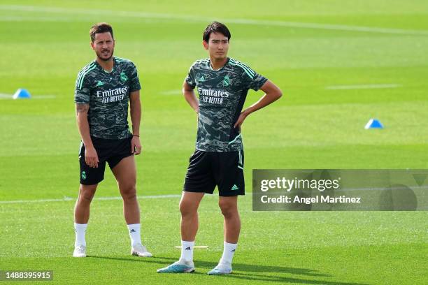 Eden Hazard and Takuhiro Nakai of Real Madrid look on during the Real Madrid training session ahead of their UEFA Champions League semi-final first...