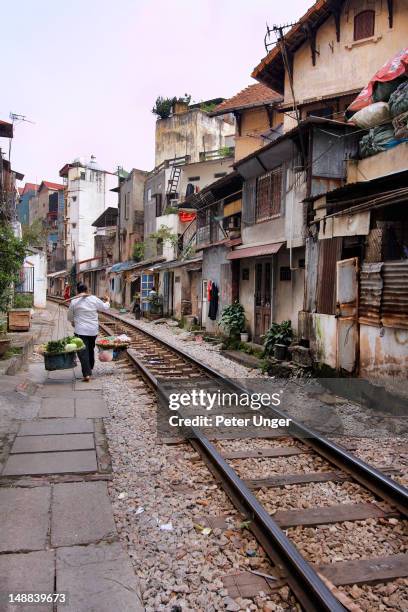 railway track through french quarter. - hanoi french quarter stock pictures, royalty-free photos & images