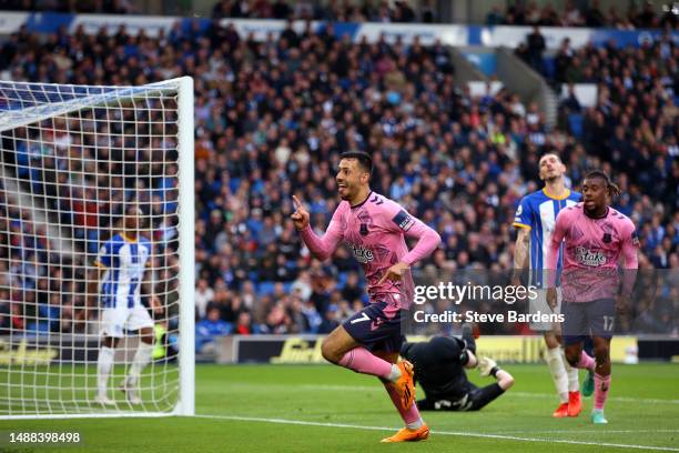 Dwight McNeil of Everton celebrates after Jason Steele of Brighton & Hove Albion scores an own goal during the Premier League match between Brighton...