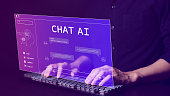 Chat with AI or Artificial Intelligence technology. Man using a laptop computer chatting with an intelligent artificial intelligence asks for the answers he wants. Smart assistant futuristic, Chat AI,