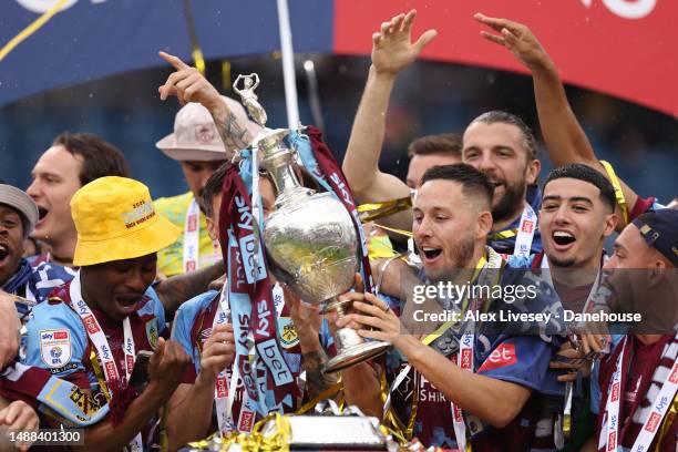 Jack Cork and Josh Brownhill of Burnley lift the Sky Bet Championship trophy after the Sky Bet Championship between Burnley and Cardiff City at Turf...