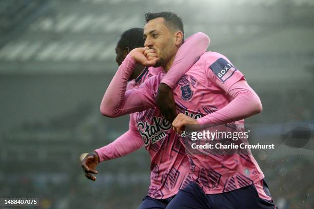 Dwight McNeil of Everton celebrates with teammate Abdoulaye Doucoure after scoring the team's fourth goal during the Premier League match between...