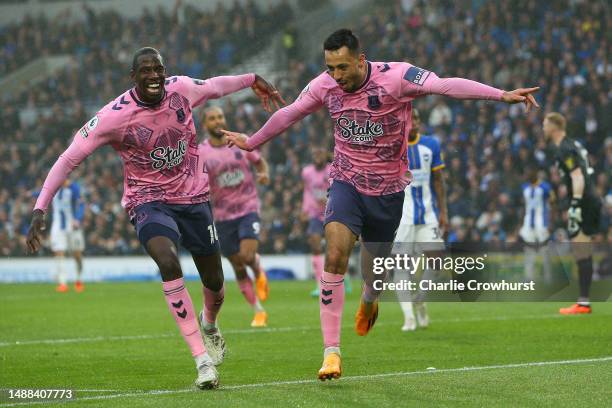 Dwight McNeil of Everton celebrates with teammate Abdoulaye Doucoure after scoring the team's fourth goal during the Premier League match between...