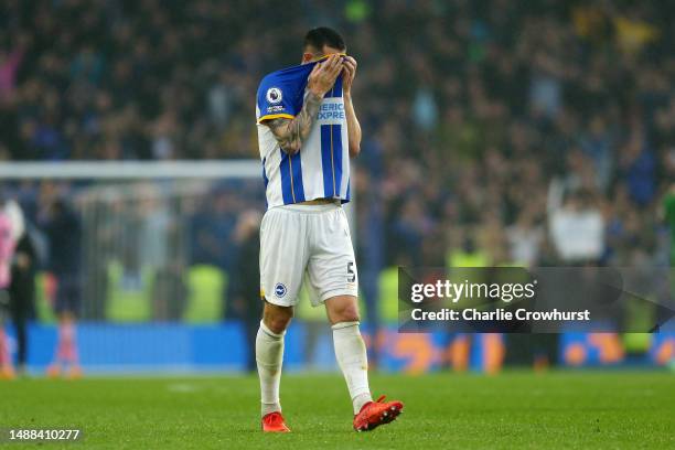 Lewis Dunk of Brighton & Hove Albion looks dejected after their side's defeat to Everton during the Premier League match between Brighton & Hove...