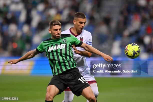 Domenico Berardi of US Sassuolo controls the ball whilst under pressure from Nicolas Dominguez of Bologna FC during the Serie A match between US...