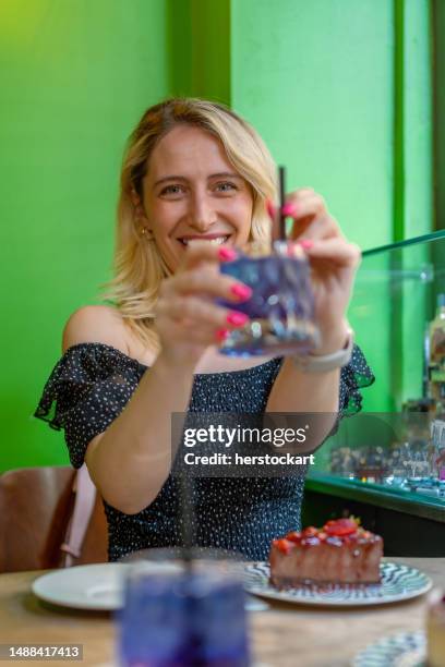 woman on the cafe with cold drink and chocolate cake - strawberry cake stock pictures, royalty-free photos & images