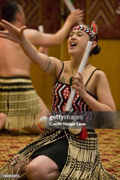 maori woman performing tititorea stick game at te puia maori cultural performance. - haka stock pictures, royalty-free photos & images