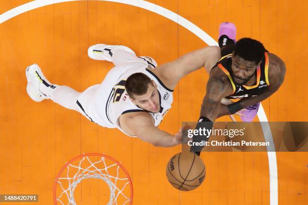 Deandre Ayton of the Phoenix Suns attempts a shot over Nikola Jokic of the Denver Nuggets during Game Four of the NBA Western Conference Semifinals...