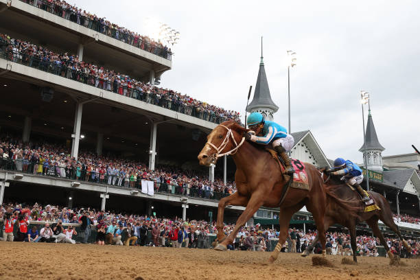 Mage, ridden by jockey Javier Castellano crosses the finish line to win the 149th running of the Kentucky Derby at Churchill Downs on May 06, 2023 in...