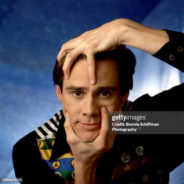 Canadian, American actor and comedian Jim Carrey poses for a portrait grabbing his head and chin in Los Angeles, California, October 24, 1994.