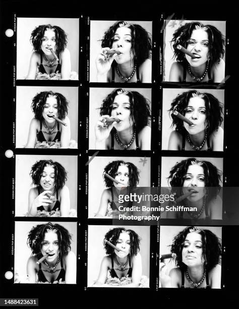 American, Canadian singer and songwriter Angela Maria Ani DiFranco smokes her cigar in these twelve images in Los Angeles, California, circa 1996.