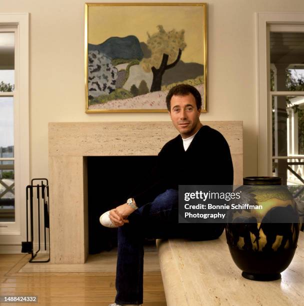 American producer and film studio executive David Geffen sits at his beach house in Los Angeles, California, February 14, 1987.