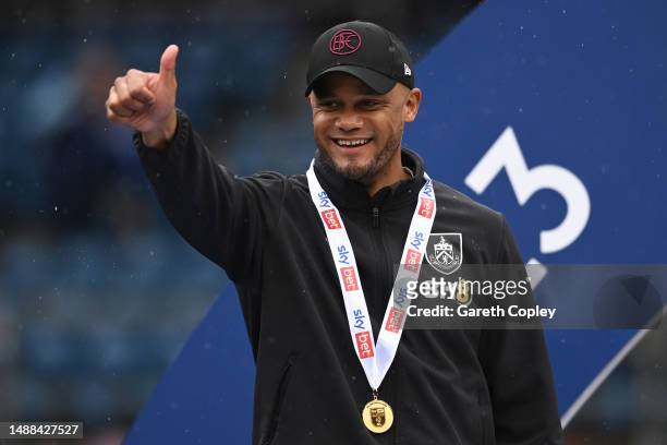 Vincent Kompany, Manager of Burnley celebrates promotion to the Premier League after defeating Cardiff City during the Sky Bet Championship between...