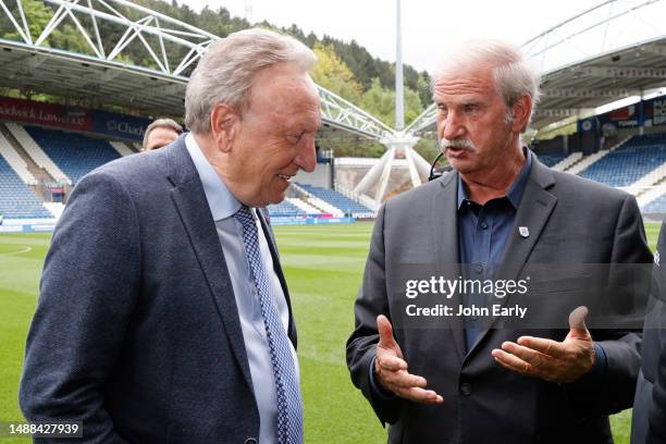 Kevin Nagle the prospective new owner of Huddersfield Town chats with Neil Warnock the Head Coach before the Sky Bet Championship between...