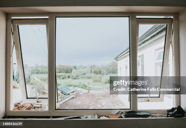 newly installed large window - window frame stock pictures, royalty-free photos & images