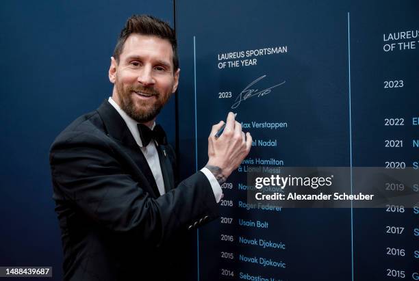 Lionel Messi winner of the Laureus World Sportsman of the Year 2023 award signs the wall at the Montblanc Signing Wall during the 2023 Laureus World...