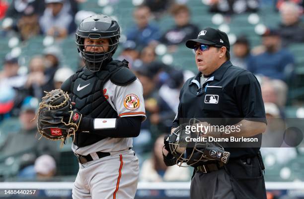 Catcher Adley Rutschman of the Baltimore Orioles and umpire Doug Eddings during a game against the Detroit Tigers at Comerica Park on April 30, 2023...