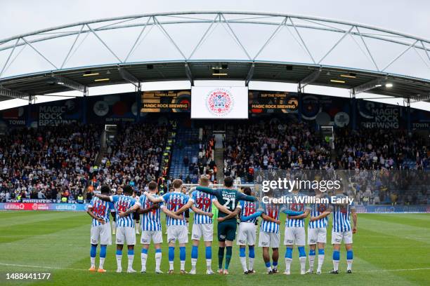 Huddersfield Town players gather to observe the national anthem before the Sky Bet Championship between Huddersfield Town and Reading at John Smith's...