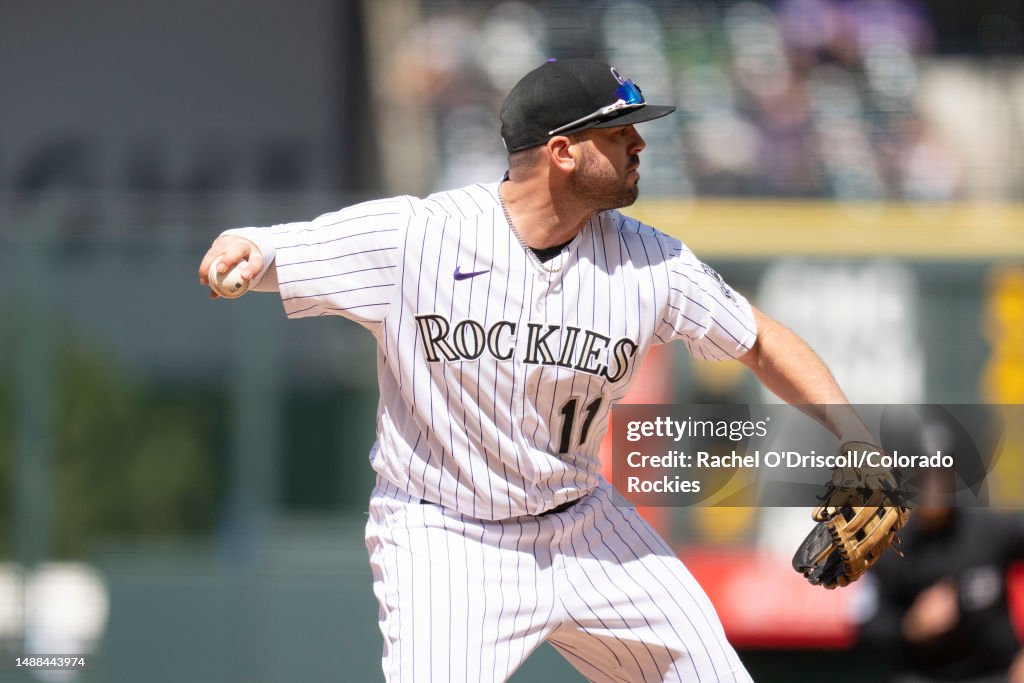 Mike Rokes Colorado Mike Moustakas of the Colorado Rockies throws to first base for an ...