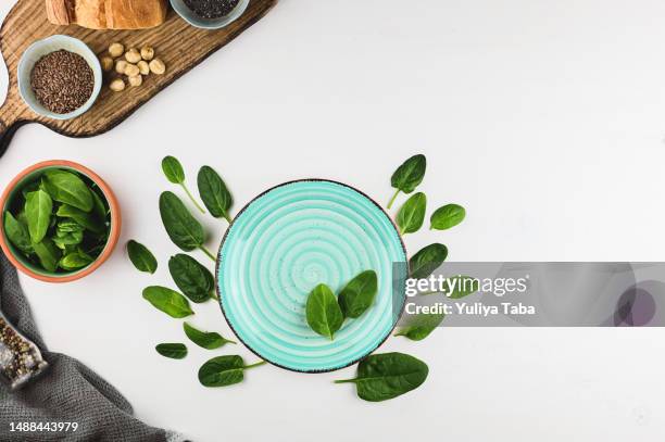 healthy eating concept. green spinach on a table. - superfood stock pictures, royalty-free photos & images