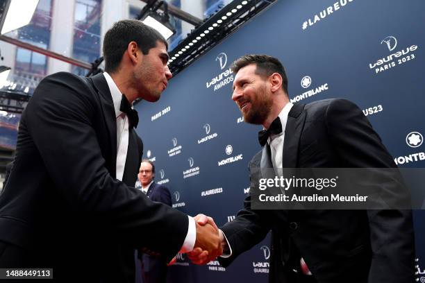 Carlos Alcaraz speaks with Lionel Messi as they arrive at the 2023 Laureus World Sport Awards Paris red carpet arrivals at Cour Vendome on May 08,...