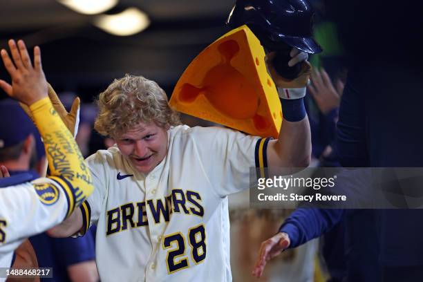 Joey Wiemer of the Milwaukee Brewers is congratulated by teammates following a three run home run against the Los Angeles Dodgers during the fifth...
