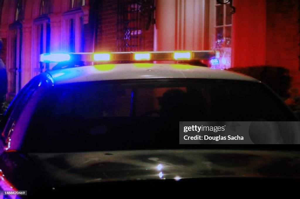 Police patrol lights flashing on car roof