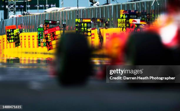 Defocussed Spanish Scuderia Ferrari Formula One racing team racing driver Fernando Alonso driving his F14 T racing car along the start and finish...