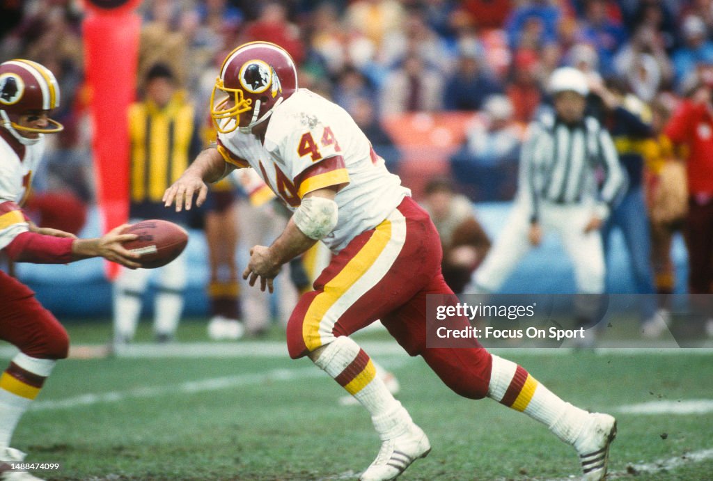 44 Redskins John Riggins John Riggins of the Washington Redskins takes a handoff against the ...