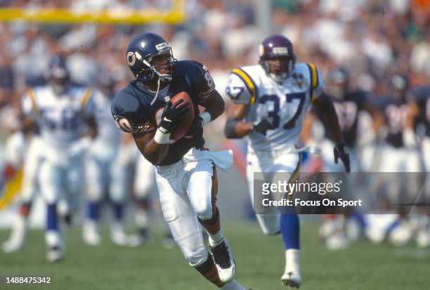 Curtis Conway of the Chicago Bears runs with a reception against the Minnesota Vikings during an NFL football game on September 3, 1995 at Soldier...