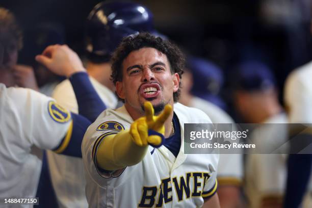 Willy Adames of the Milwaukee Brewers celebrates a three run home run against the Los Angeles Dodgers during the seventh inning at American Family...
