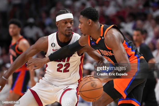 Barrett of the New York Knicks dribbles upcourt while being defended by Jimmy Butler of the Miami Heat during Game Four of the Eastern Conference...