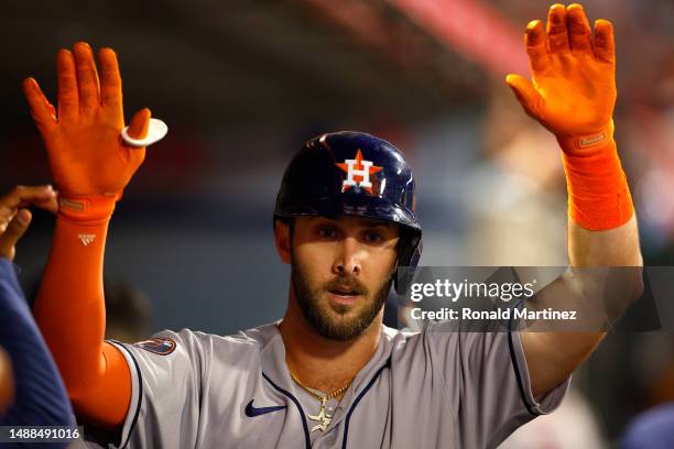 David Hensley of the Houston Astros celebrates a home run against the Los Angeles Angels in the fifth inning at Angel Stadium of Anaheim on May 08,...