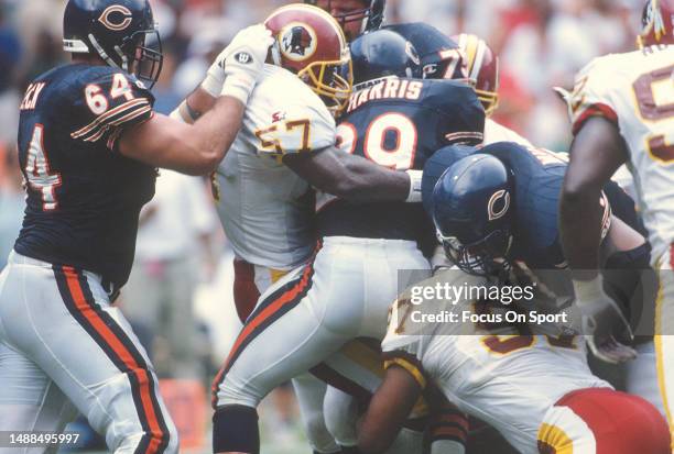 Ken Harvey of the Washington Redskins stops Raymont Harris of the Chicago Bears during an NFL football game September 8, 1996 at RFK Stadium in...