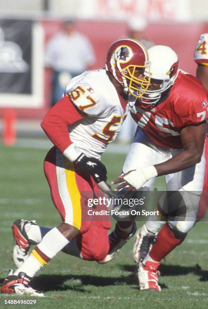 Ken Harvey of the Washington Redskins pass rushes against the Arizona Cardinals during an NFL football game on December 15, 1996 at Sun Devil Stadium...