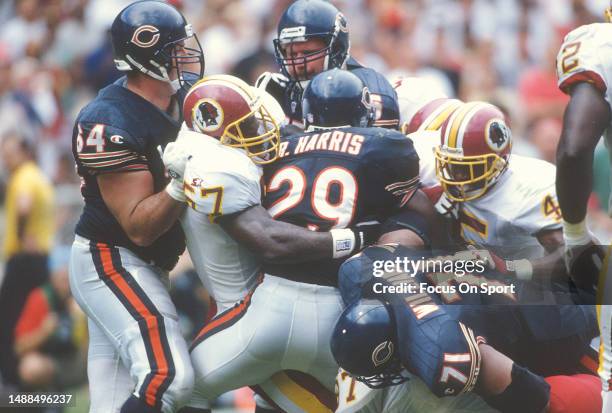 Ken Harvey of the Washington Redskins stops Raymont Harris of the Chicago Bears during an NFL football game September 8, 1996 at RFK Stadium in...