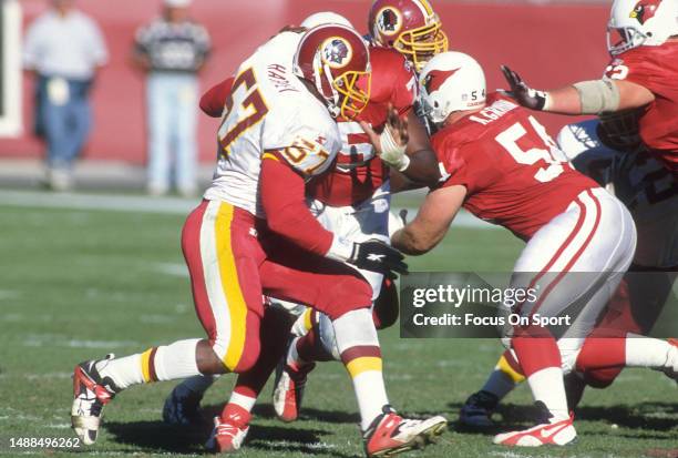 Ken Harvey of the Washington Redskins pass rushes against the Arizona Cardinals during an NFL football game on December 15, 1996 at Sun Devil Stadium...