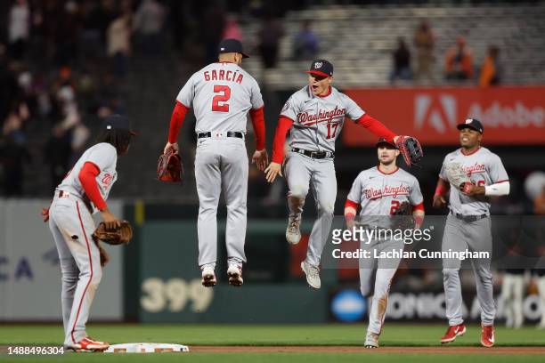 Luis Garcia and Alex Call of the Washington Nationals celebrate after a win against the San Francisco Giants at Oracle Park on May 08, 2023 in San...