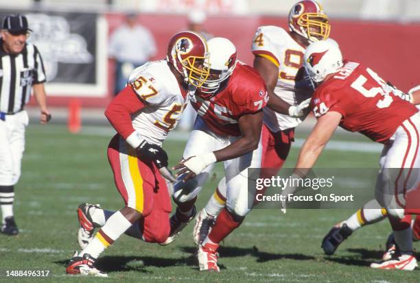 Ken Harvey of the Washington Redskins pass rushes against the Arizona Cardinals during an NFL football game on December 15, 1996 at Sun Devil Stadium...