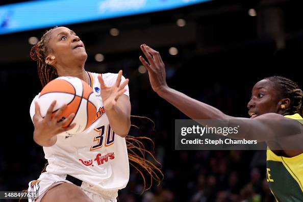 Kadi Rouse Kadi Sissoko of the Phoenix Mercury shoots against Seattle Storm ...